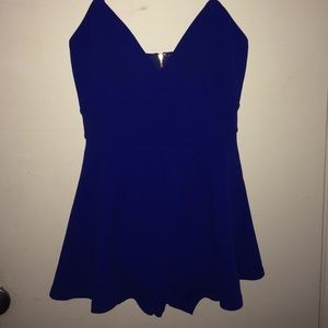 Navy blue romper with a gold zipper