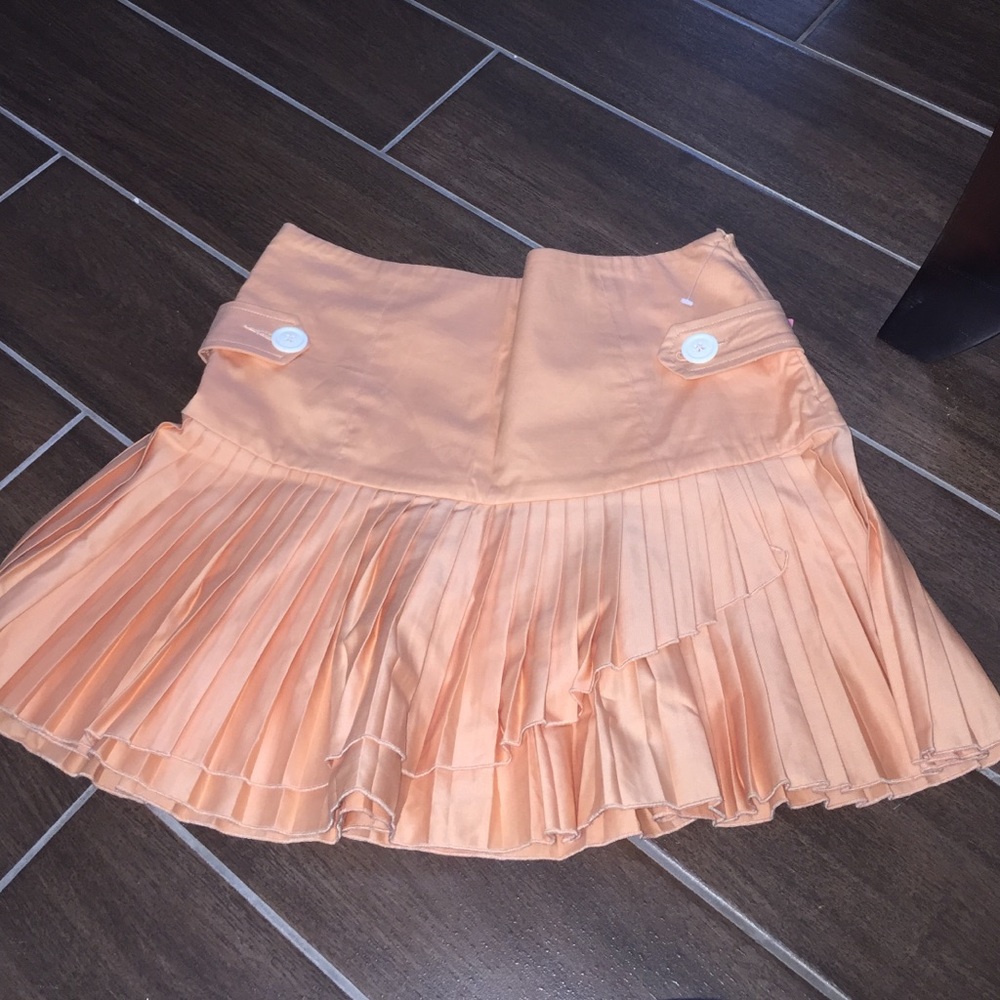 Pleated orange skirt