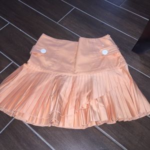 Pleated orange skirt