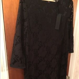 New black dress with tags and lace over body