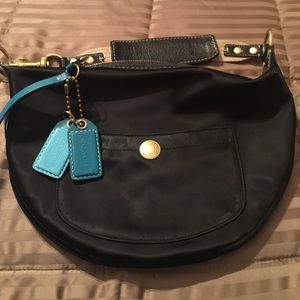 Like new, black nylon Coach shoulder bag.