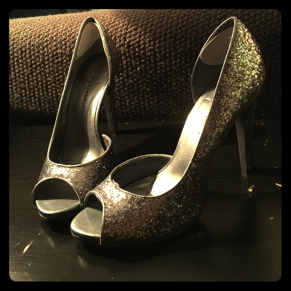 Sparkly, dark silver, peep toe, high heels.