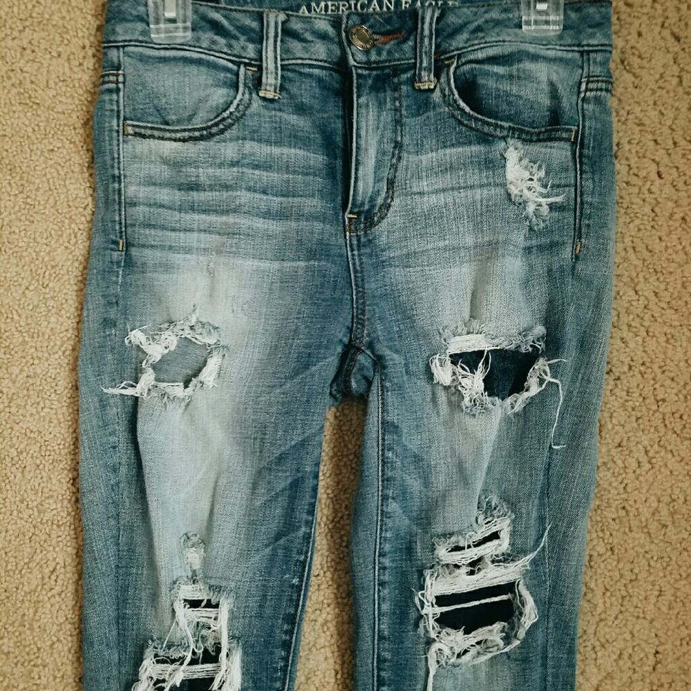 faded ripped blue jeans