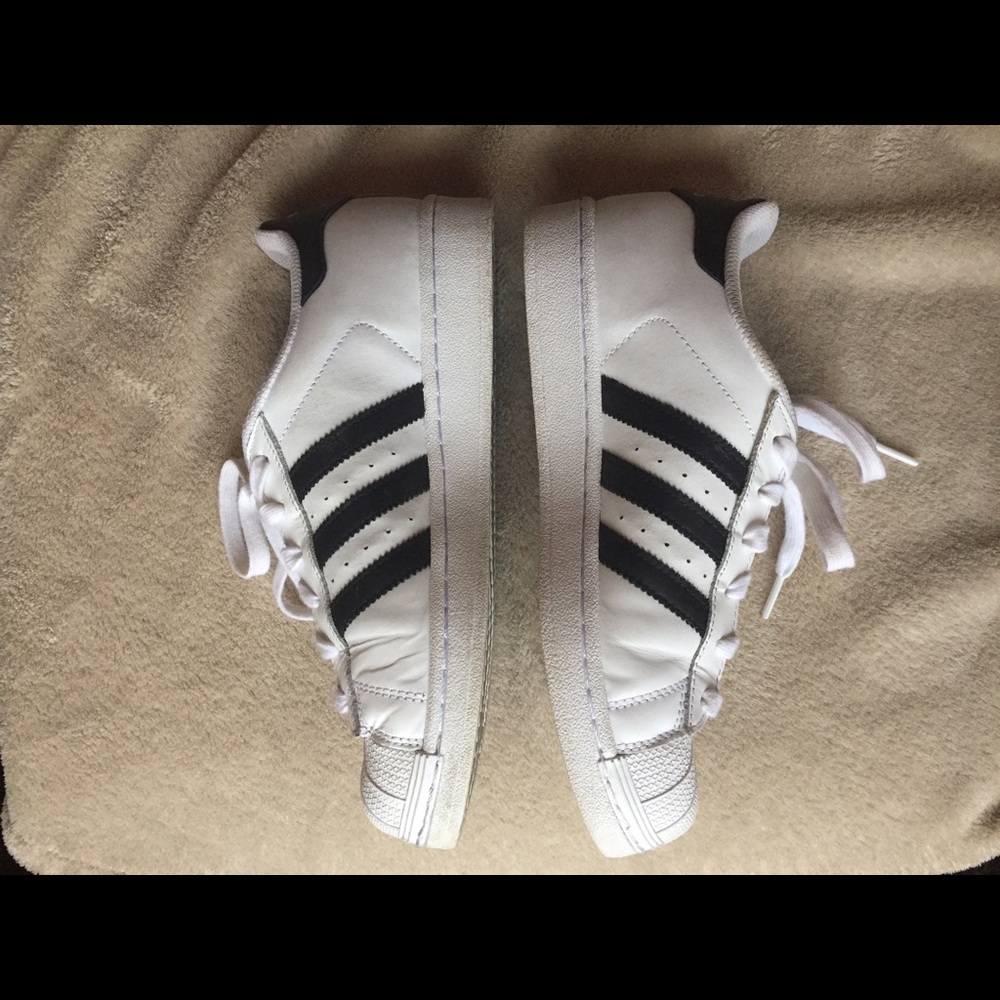 Adidas Superstars! White with black stripes.