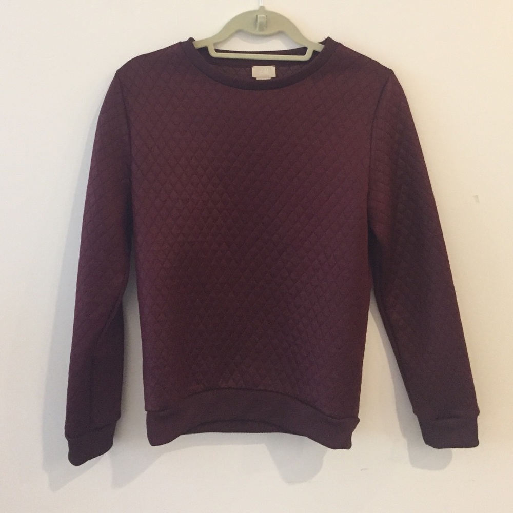 Maroon, slightly metallic sweatshirt