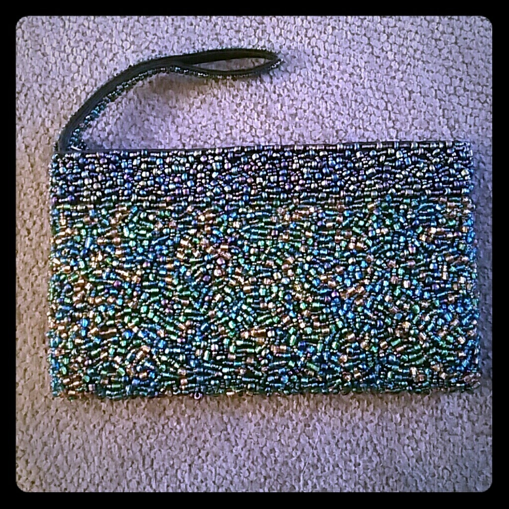 Beaded peacock colored clutch.