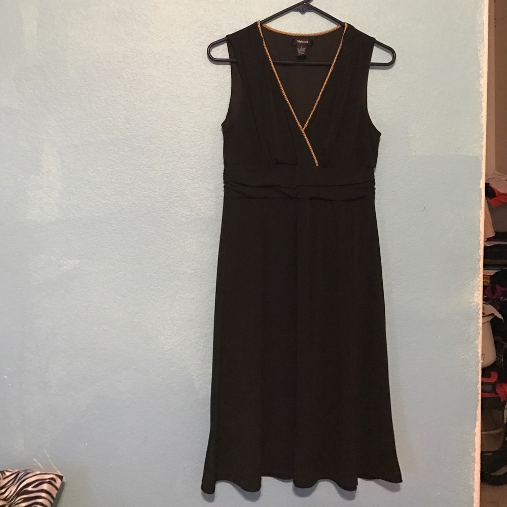 Little black dress. Vneck and gold trim