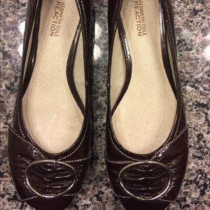 Brown Kenneth Cole flats with silver buckles