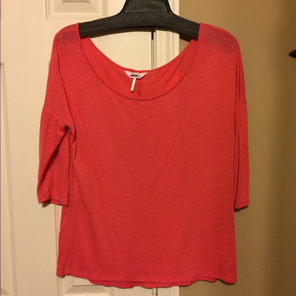 Salmon/peachy colored 3/4 length size small shirt