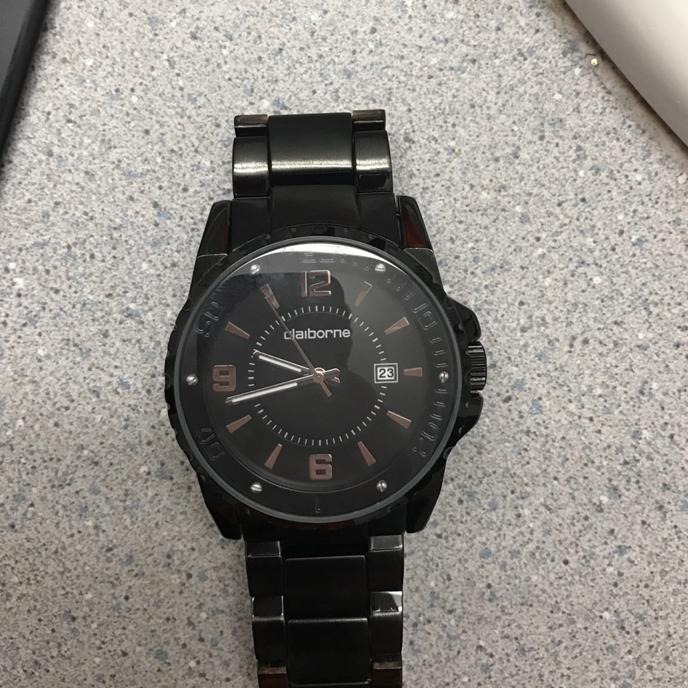A black, shiny steel Claiborne watch.
