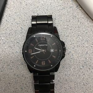 A black, shiny steel Claiborne watch.