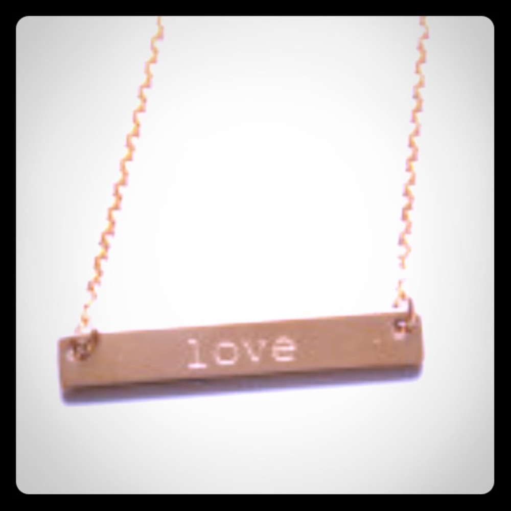 Still in packaging, never tried on!  Love Necklace