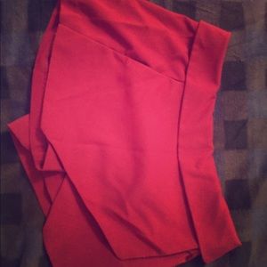 VERY dark red shorts.- Maroon red.