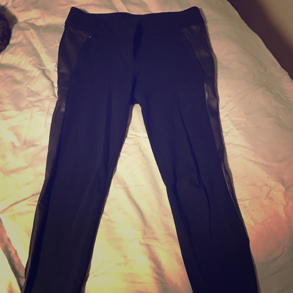 Black skinny ankle pants with leather side detail