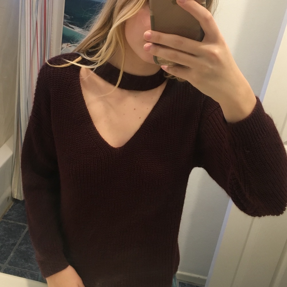 maroon sweater with a cut out