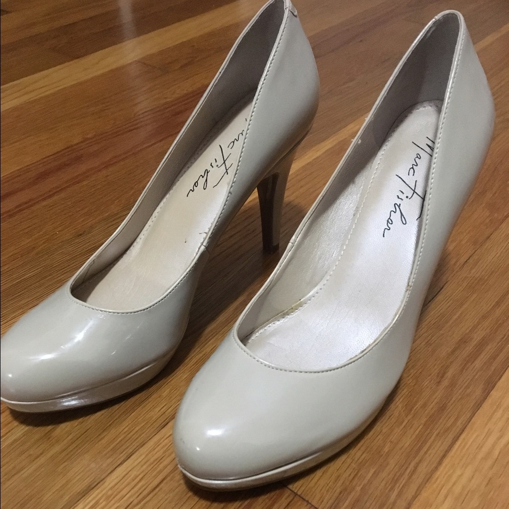Nude color high heels.