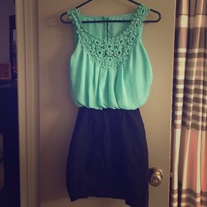 Mint green flowy top, black fitted skirt dress