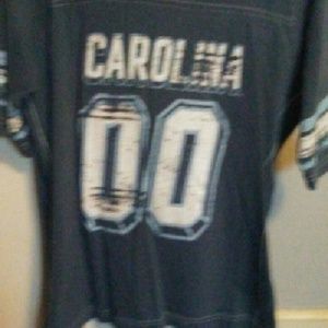 A blue UNC Tarheel shoet sleeved shirt.