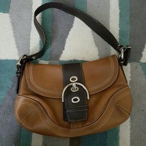 Brown and black coach purse
