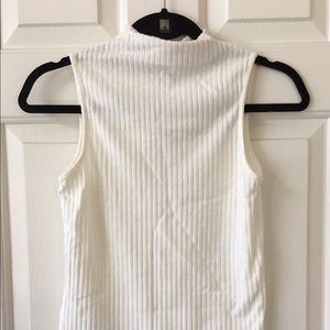 White mock-neck sleeveless top