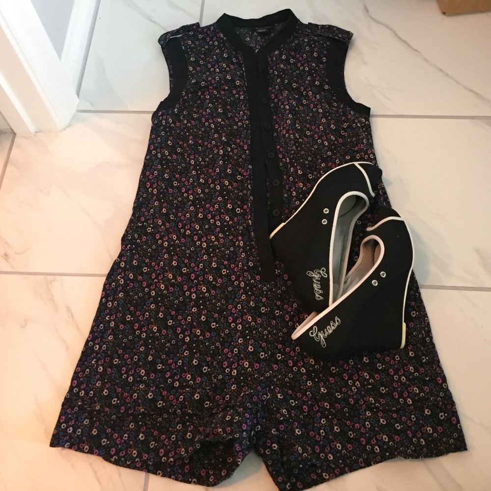 Sleeveless Floral Romper with adorable detail.