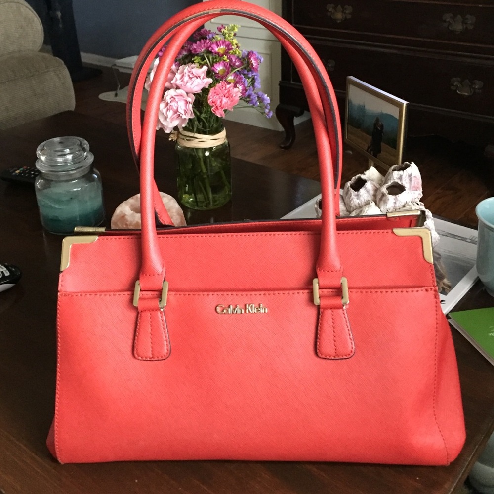 Calvin Klein orange leather purse.