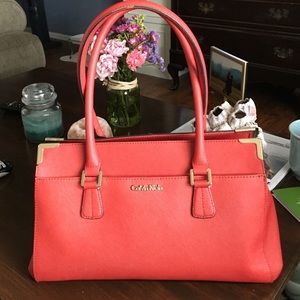 Calvin Klein orange leather purse.