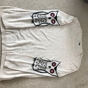 Cream sweater with owls on sleeves