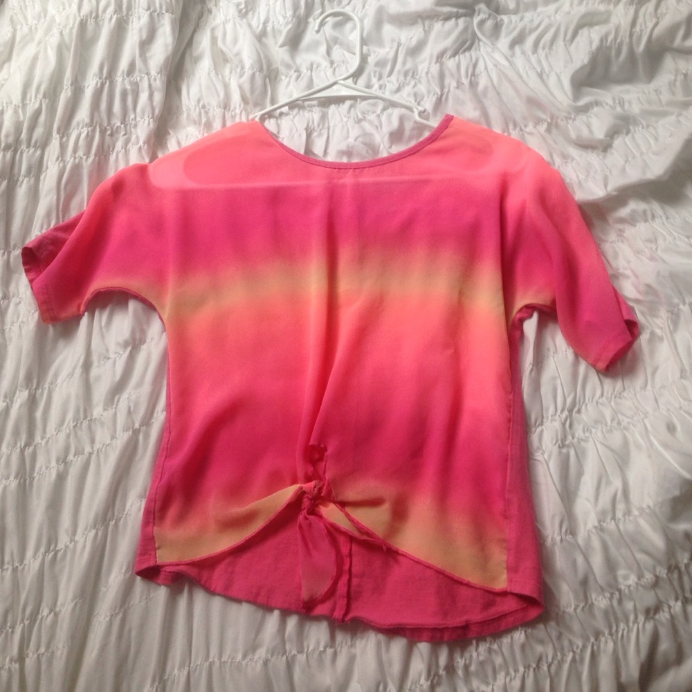 A 3/4 sleeve pink/orange/yellow shirt