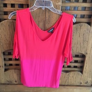 This Bebe top is xs red and pink worn once