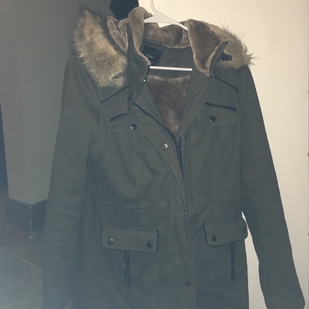 Trendy forest green coat with faux fur hood