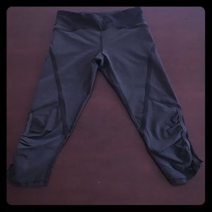 Lululemon cropped black and grey workout pants.