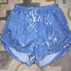 Blue and white nike running shorts