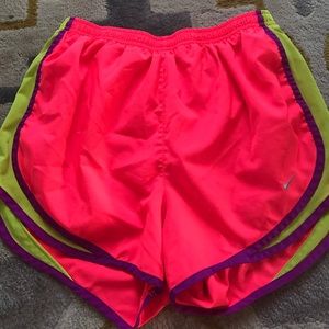 Neon pink nike running shorts