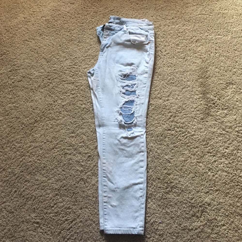 Mossimo light washed, purposefully ripped jeans.