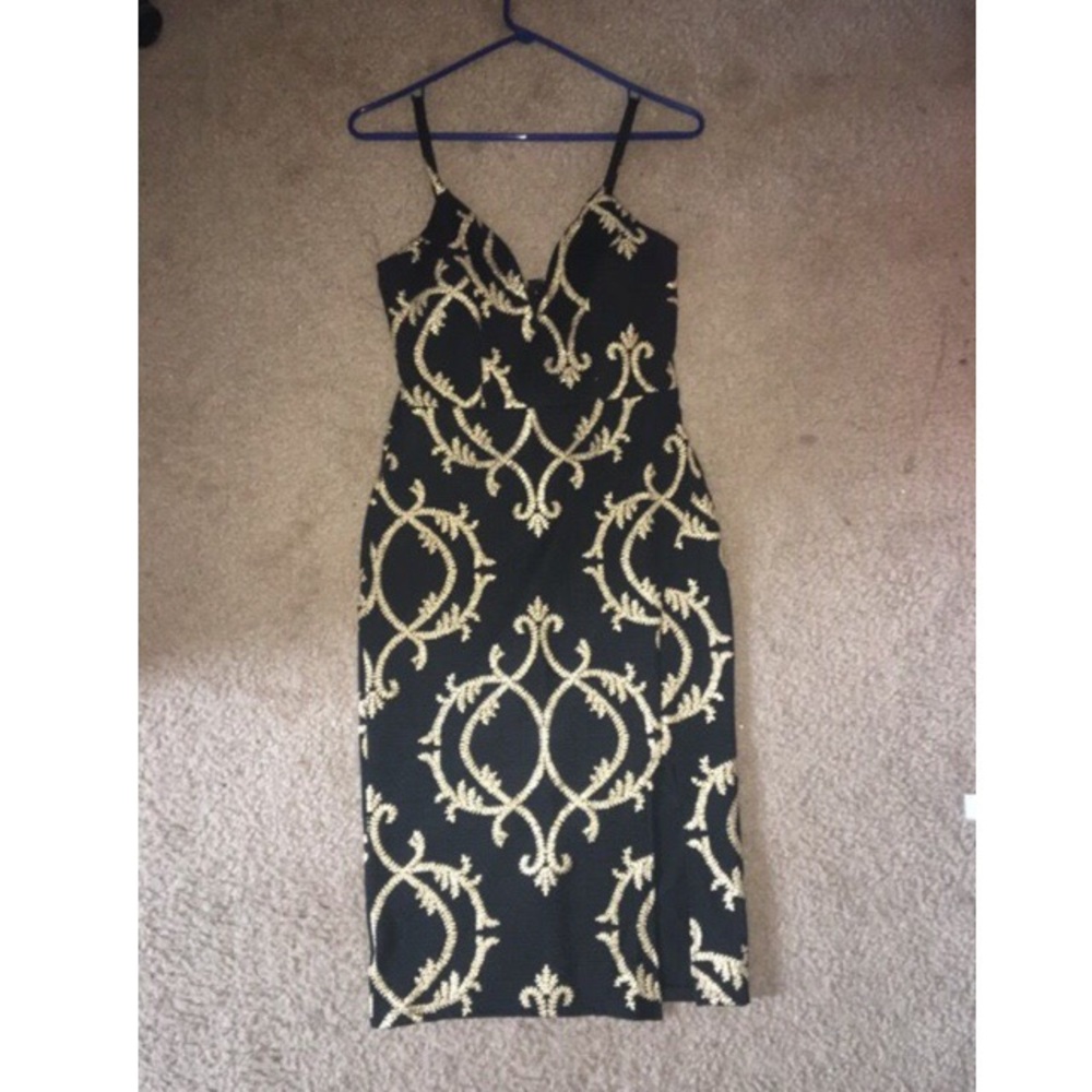 Knee length black and gold dress