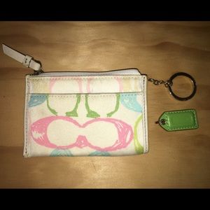 Multi colored coach coin purse.