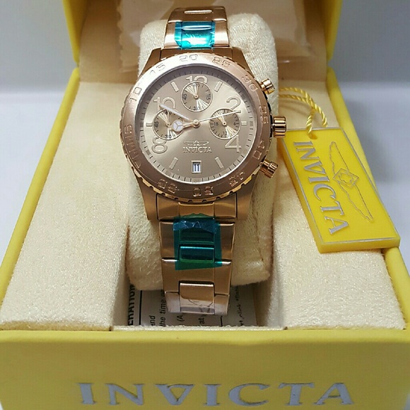 Big saleInvicta $700 18k unisex gold watch.