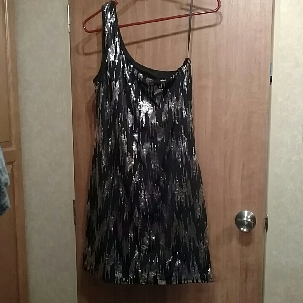 Sparkling black one shoulder sequin dress.