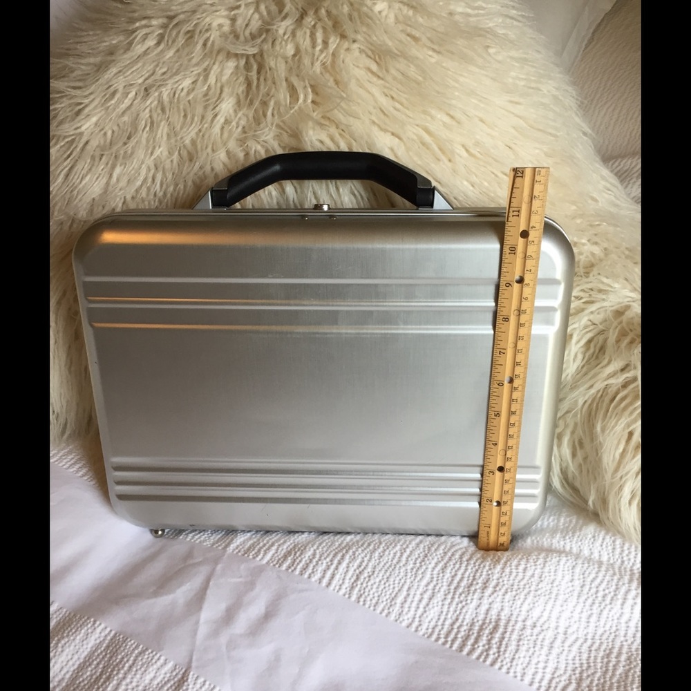Silver briefcase with two keys for lock