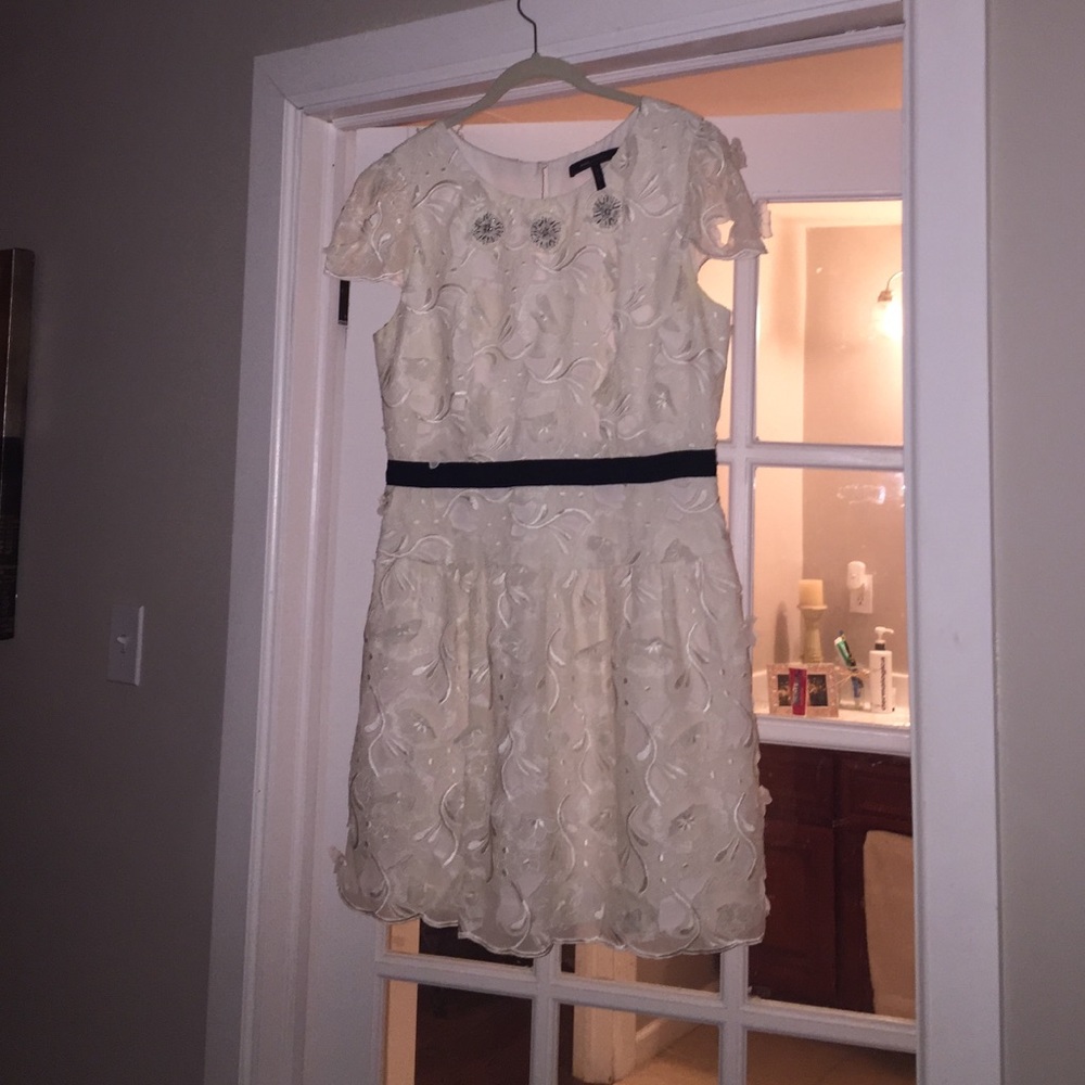 BCBGMAXARIA cream dress with black accent.