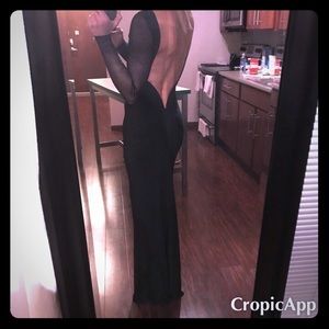 Long sleeve black dress. Deep V open back