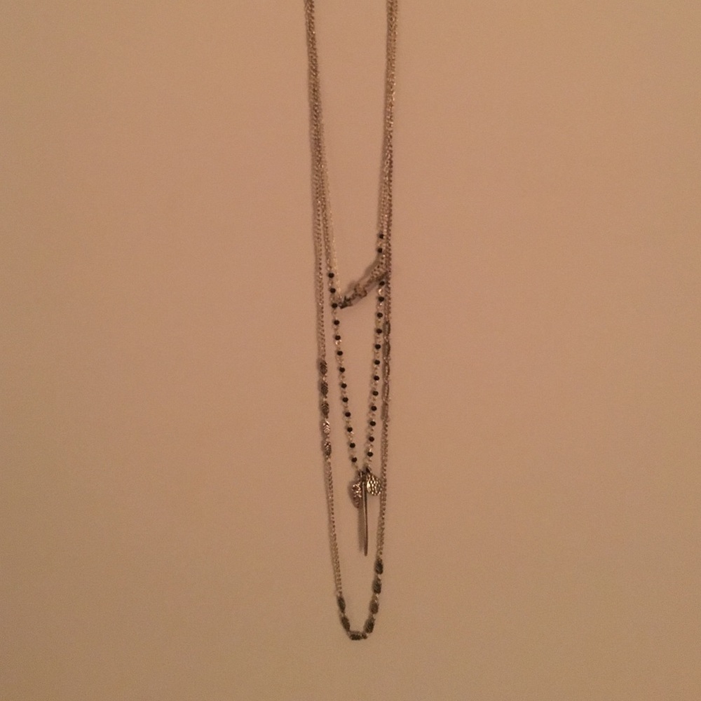 layered gold and black necklace