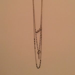 layered gold and black necklace