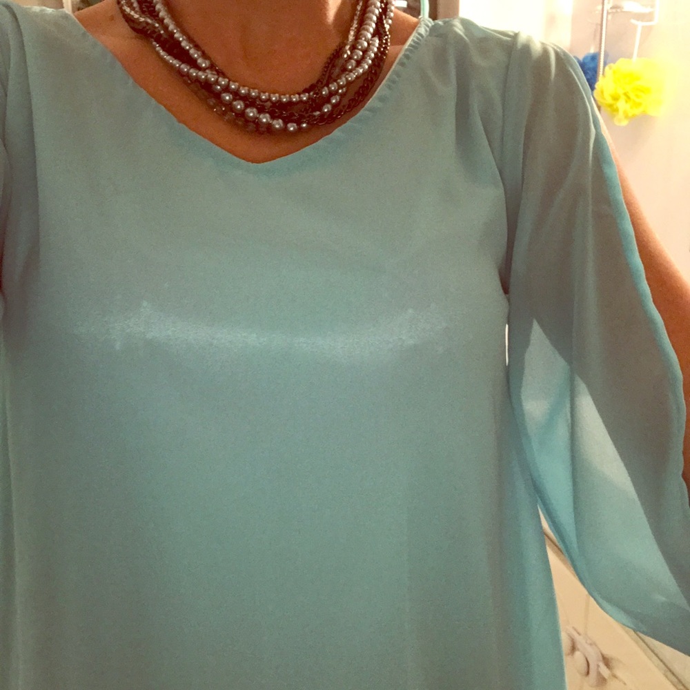 Boutique bought shimmer blue top.size med