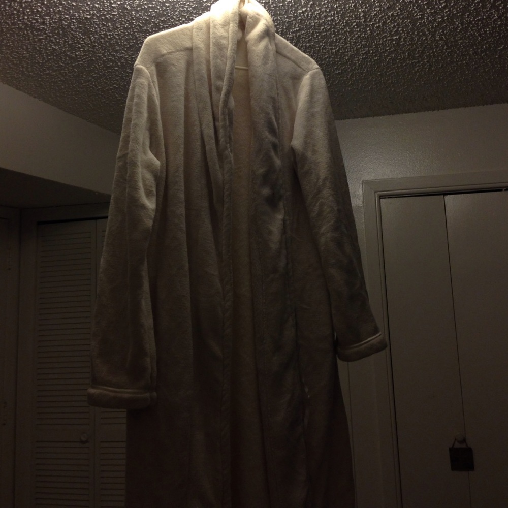 A bath robe has a couple stains