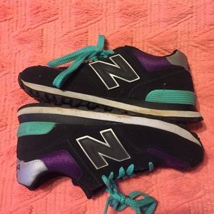 New Balance 574 running shoes.