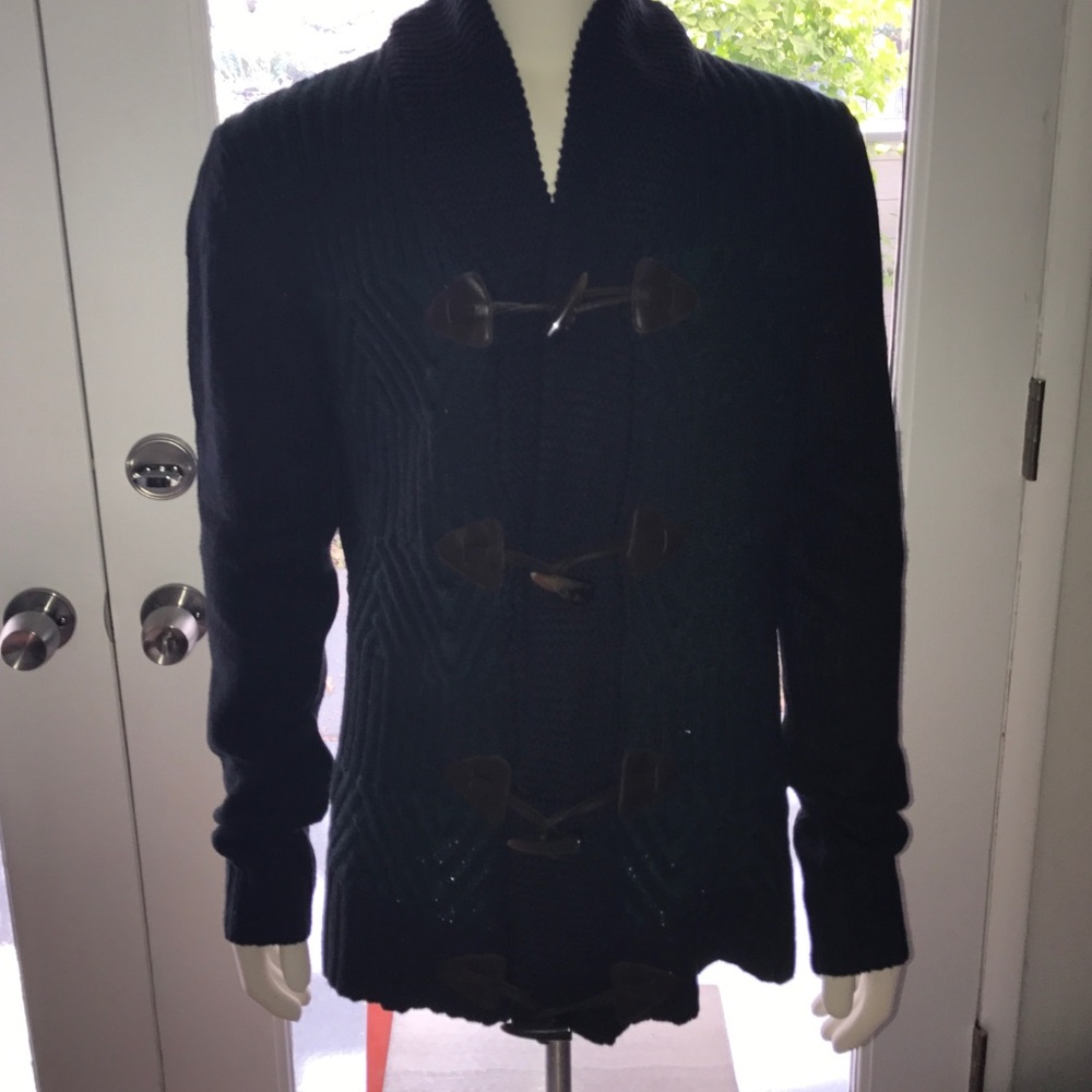 Double breasted sweater.