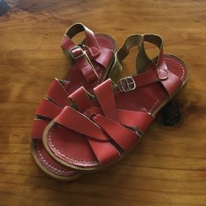 Red saltwater sandals.