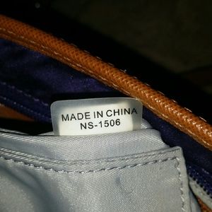 MK original Cross Body eggplant color.